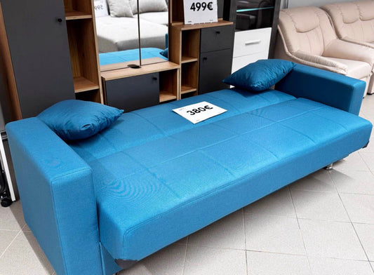 Zils dīvāns ar guļamo funkciju un diviem spilveniem